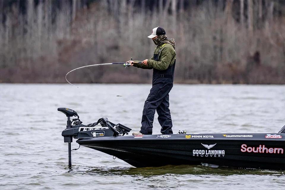Chase Carey fishing from the bow of the boat